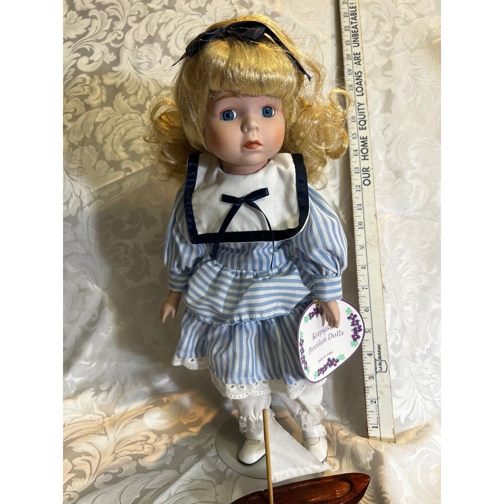 Keepsake porcelain Doll with stand. Carly